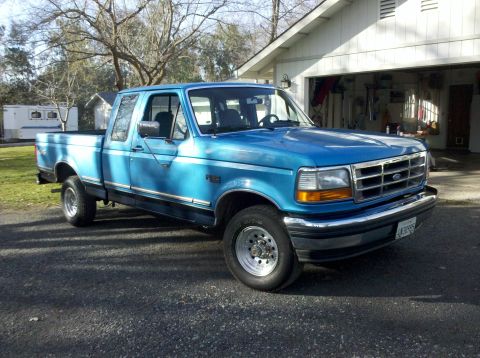 1992 Ford F-150 - Blue 1992 Ford F-150 pickup truck with a crew cab and long bed.