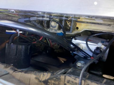 1992 Ford F-150 - Detail view of complex wiring and a silver component with blue text, likely part of an aftermarket modification.