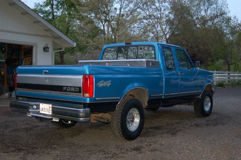 1992 Ford F-150 - This 1992 Ford F-150 pickup truck is seen from the rear, a toolbox mounted in the bed.