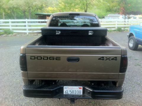 2001 Dodge Dakota - Rear view of a 2001 Dodge Dakota pickup truck, showing the tailgate and a toolbox in the bed.