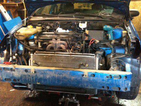 2002 Ford Focus - Front bumper removed to reveal the engine bay of a 2002 Ford Focus.