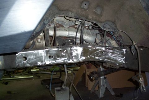 1988 Ford Bronco - Vehicle frame being welded and repaired, showing structural components.