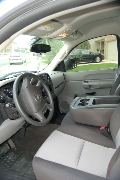 2007 Chevrolet Silverado 1500 - The interior of a 2007 Chevrolet Silverado 1500, the dashboard, steering wheel, and two-tone seats.