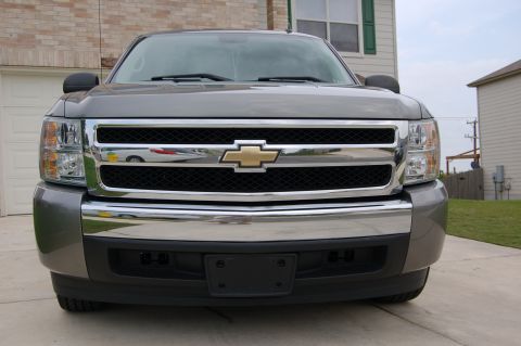 2007 Chevrolet Silverado 1500 - Front view of a gray 2007 Chevrolet Silverado 1500 pickup truck, its distinctive chrome grille and headlights.