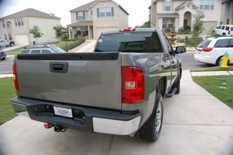 2007 Chevrolet Silverado 1500 - Rear view of a gray 2007 Chevrolet Silverado 1500 pickup truck parked in a driveway.
