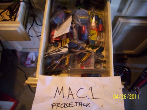1993 Ford Probe - A drawer is filled with various automotive parts, with a handwritten note and date visible.