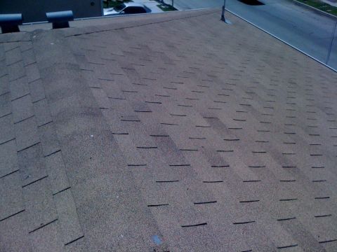 1968 Ford Mustang - The image shows a rooftop with asphalt shingles, not a 1968 Ford Mustang.