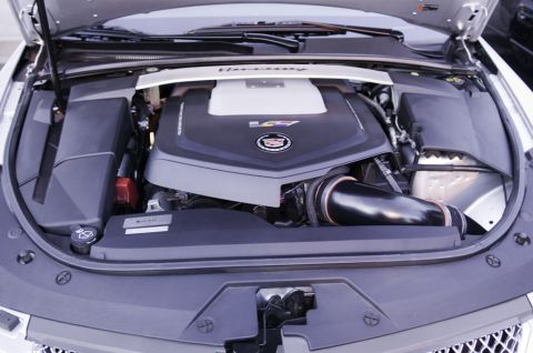 2006 Cadillac STS - The engine bay of a Cadillac shows a V8 engine with a Hennessey performance strut tower brace.