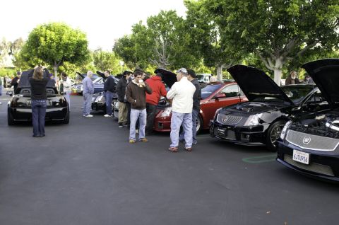2006 Cadillac STS - Cadillac CTS-V sedans gathered at a car meet, hoods up for display.