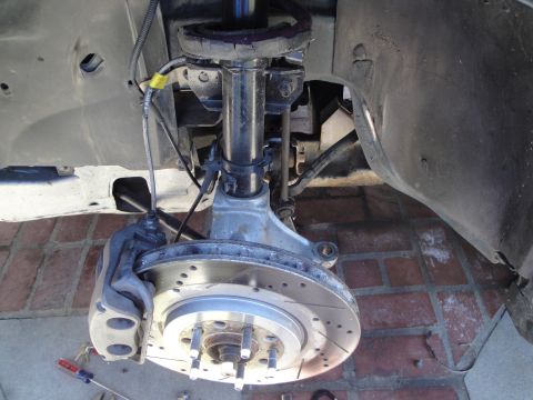 1995 Ford Taurus - This image shows a close-up view of a vehicle's suspension and braking system components.