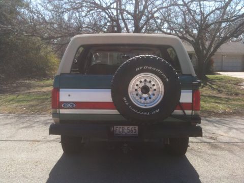 1989 Ford Bronco - Rear view of a 1989 Ford Bronco, showing the spare tire and license plate.