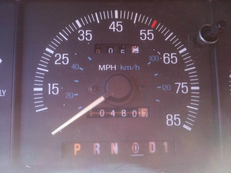 Speedometer and odometer in a vehicle, showing 4807 miles. Gear selector is in 'D'