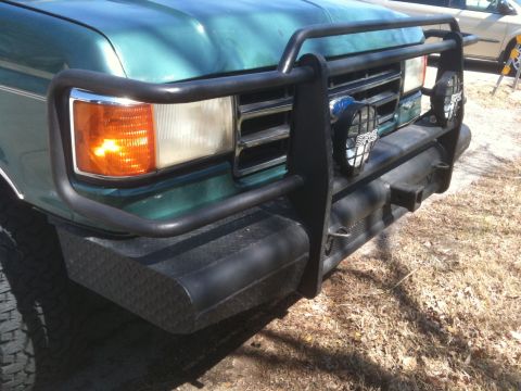 1989 Ford Bronco - Front view of a 1989 Ford Bronco, equipped with a heavy-duty brush guard and auxiliary lights.