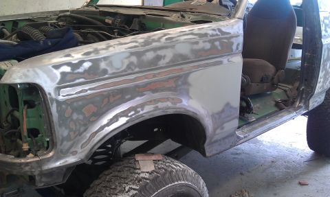 1995 Ford Bronco - This Ford Bronco is in the process of body repair, with the fender and door area prepped for paint.