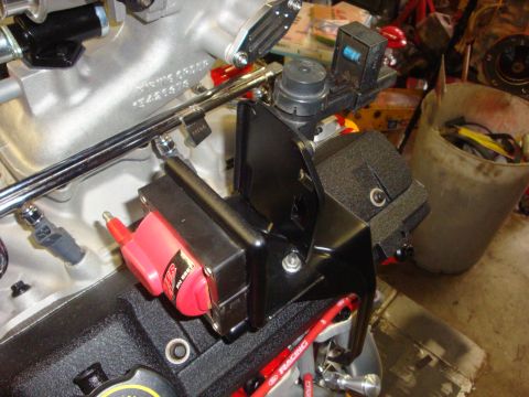 1989 Ford Bronco - Close-up view of engine components, including an ignition coil and intake manifold.