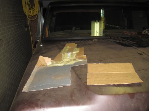 1979 Ford Bronco - Cardboard templates are laid out on the hood of a vehicle, possibly for a custom body modification.