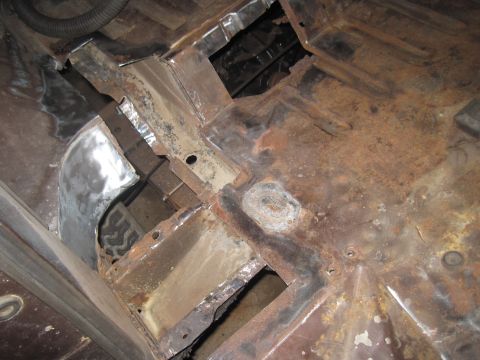 1979 Ford Bronco - Vehicle floor pan undergoing repair, showing extensive rust and new metalwork.