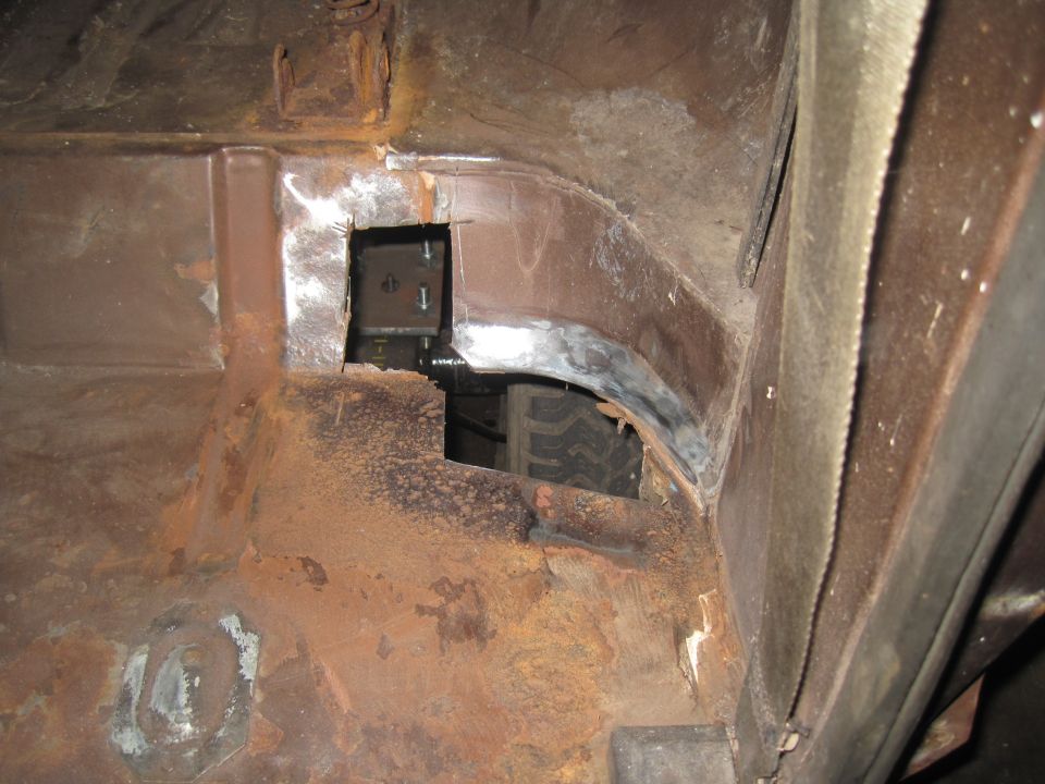 Interior body panel with tire visible through opening