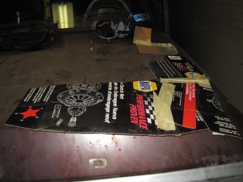 1979 Ford Bronco - A NAPA clutch kit box is placed on the hood of a vehicle, obscuring most of the car's details.