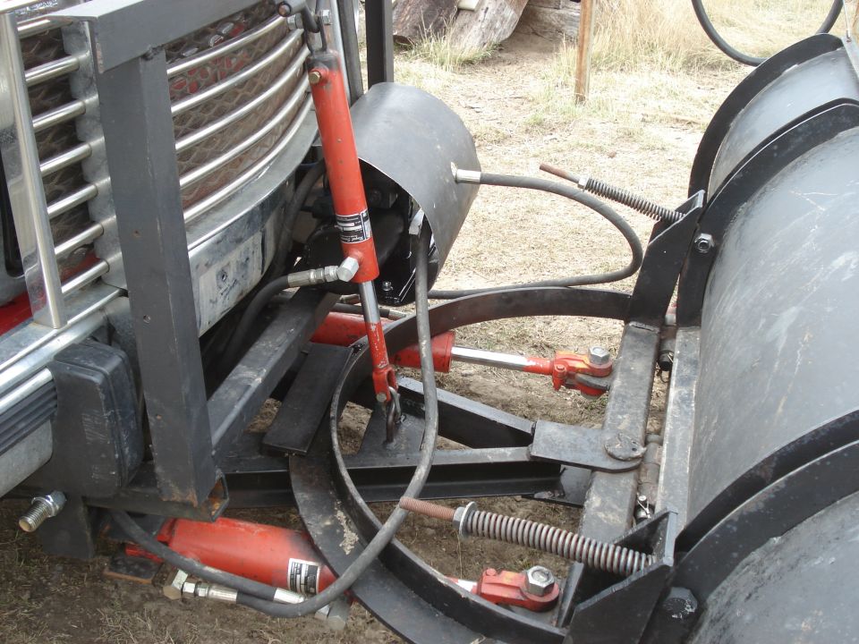 1994 GMC Sierra 3500 front plow assembly with hydraulic cylinders and chrome grille