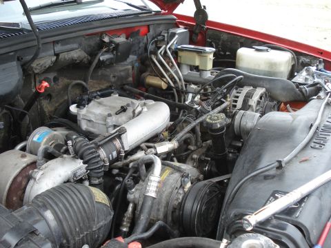 1994 GMC Sierra 3500 - Close-up view of a vehicle's engine bay, showing mechanical parts and wiring.