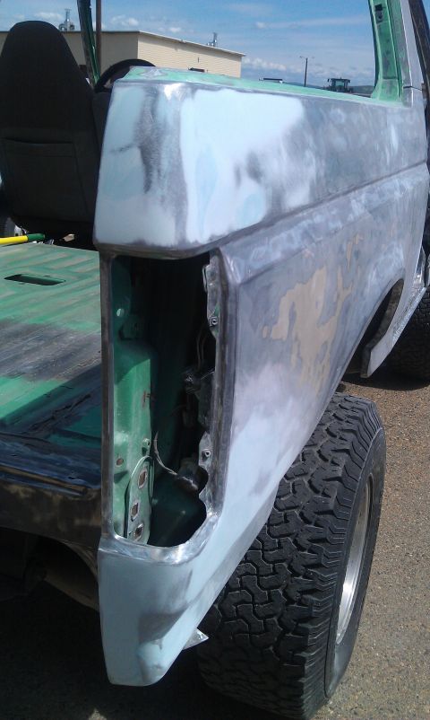 1995 Ford Bronco - Rear quarter panel of a 1995 Ford Bronco undergoing bodywork and repair.