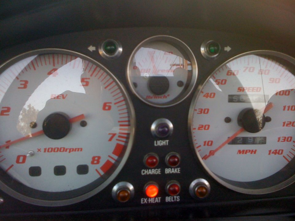 Tachometer and speedometer gauges, with lights for 'LIGHT', 'CHARGE BRAKE', and 'EX-HEAT BELTS'