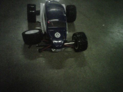 2011 Ford 427 - A remote control car with a Volkswagen logo is shown from the front.