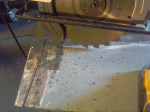 1989 Ford Bronco - A circular saw blade is shown with metal debris scattered on the work surface.