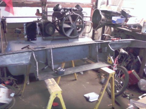 1989 Ford Bronco - A metal fabrication project is underway in a workshop, with tools and equipment visible in the background.