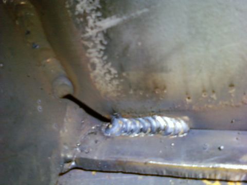 1989 Ford Bronco - A close-up view of a metal surface shows a welded seam with distinct bead patterns.