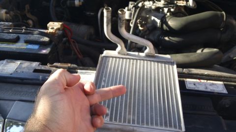 1994 Ford Bronco - Heater core removal for a 1994 Ford Bronco, showing the engine bay components.