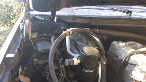 1994 Ford Bronco - Close-up view of engine bay components and hoses, likely from a truck or SUV.
