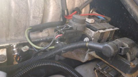 1994 Ford Bronco - Close-up view of an engine component with visible wiring and connectors.