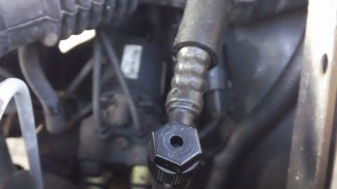 1994 Ford Bronco - Engine hose fitting detail.