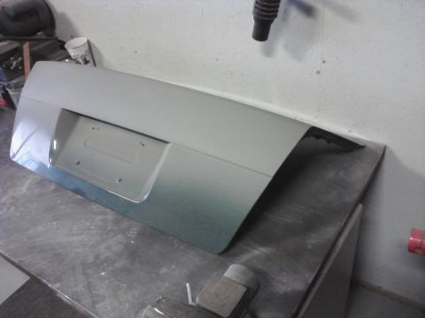 2001 Volkswagen Jetta - A car trunk lid is shown resting on a workbench in a garage setting.