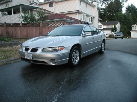 2002 Pontiac Grand Prix - The front grille and overall body style are consistent with a 2002 Pontiac Grand Prix.