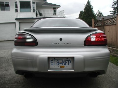 2002 Pontiac Grand Prix - Rear view of a silver 2002 Pontiac Grand Prix showing its distinctive taillights and spoiler.