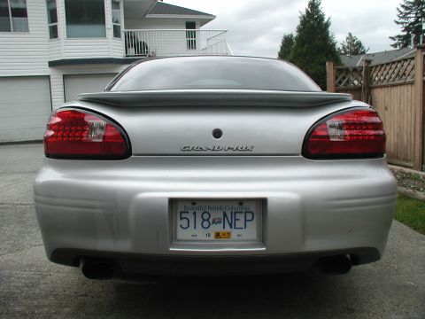 2002 Pontiac Grand Prix - Rear view of a silver 2002 Pontiac Grand Prix, LED tail lights and a spoiler.