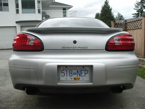 2002 Pontiac Grand Prix - Rear view of a silver 2002 Pontiac Grand Prix showing its taillights and spoiler.