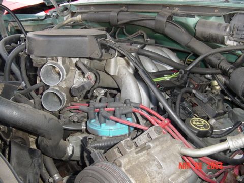 1989 Ford Bronco - Engine bay detail with throttle body and distributor cap visible. Date stamp MAR 28 2005.