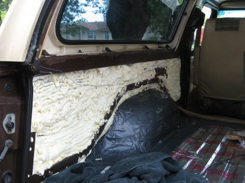 1979 Ford Bronco - Interior of a 1979 Ford Bronco undergoing sound deadening and insulation work.