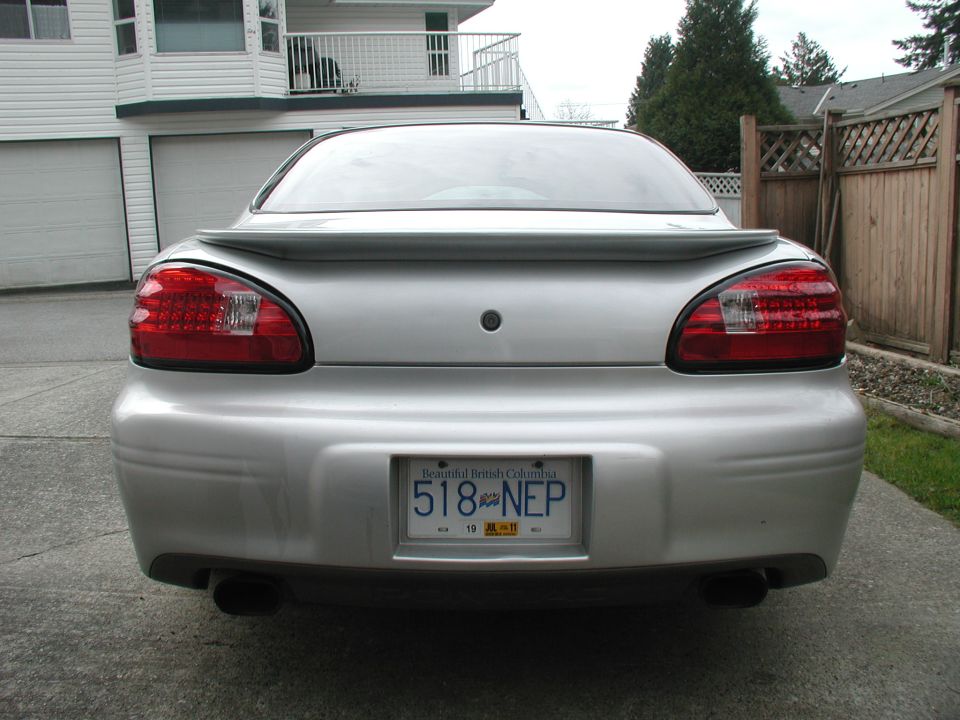 Rear view of a silver Pontiac Grand Prix sedan with British Columbia plate