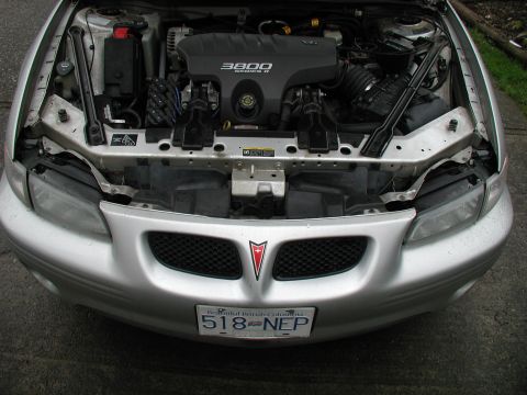 2002 Pontiac Grand Prix - The engine bay of a silver 2002 Pontiac Grand Prix is shown, the 3800 Series II engine.