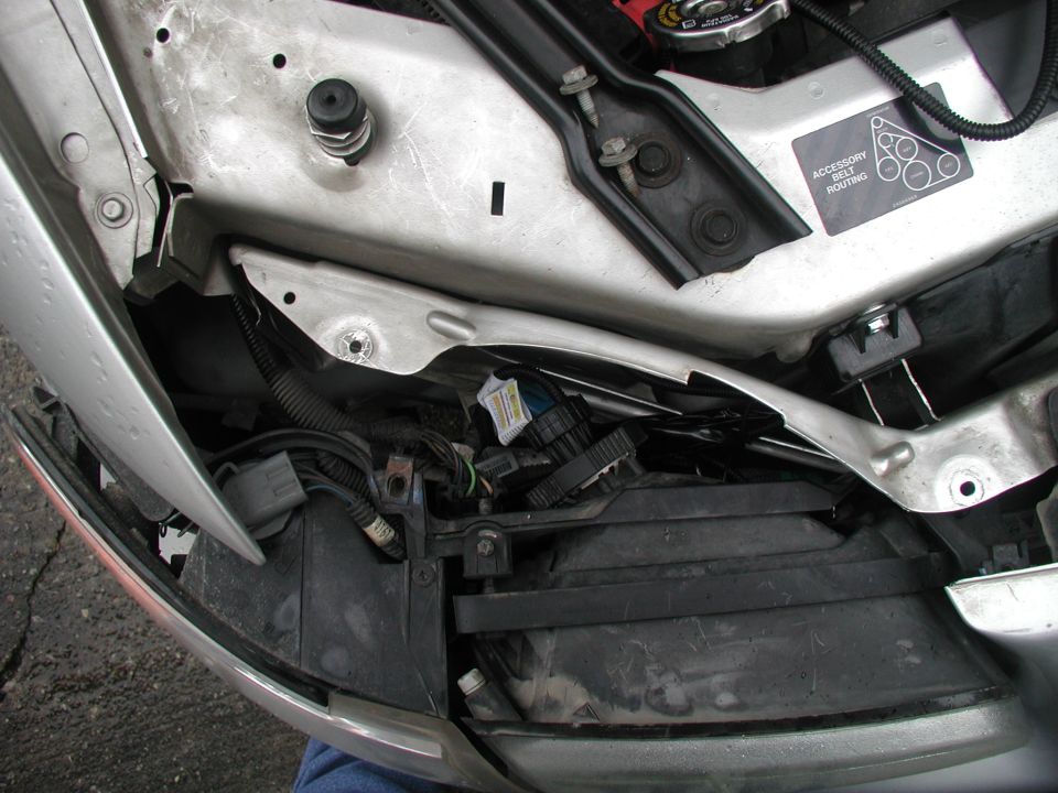Headlight assembly with wiring and accessory belt routing diagram