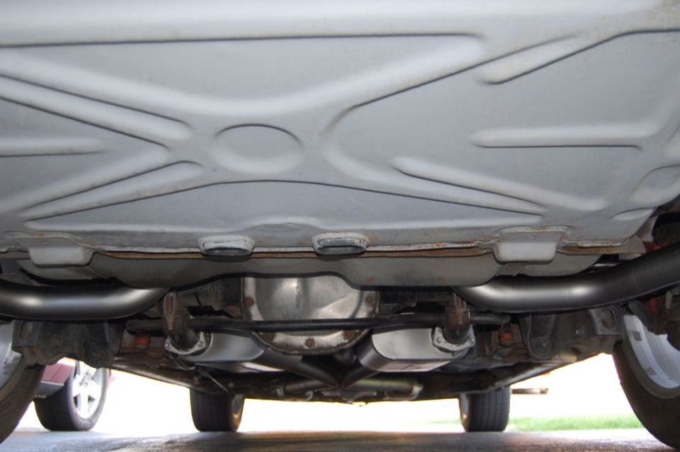 Underbody view of dual exhaust system with mufflers and pipes