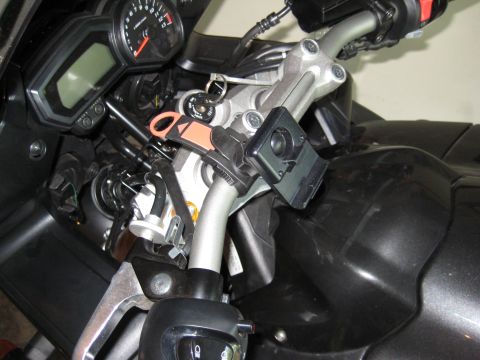 2008 Yamaha FZR1000 - Close-up view of a motorcycle's dashboard and handlebars, showing instruments and a mounted phone holder.