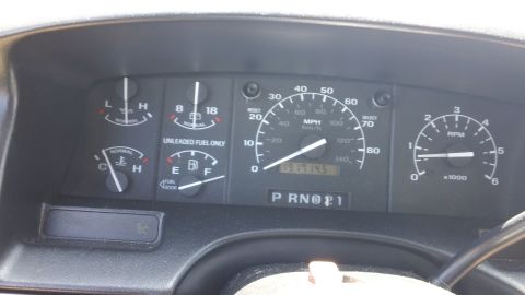 1994 Ford Bronco - Interior view of a 1994 Ford Bronco's dashboard, displaying various gauges and the odometer reading.