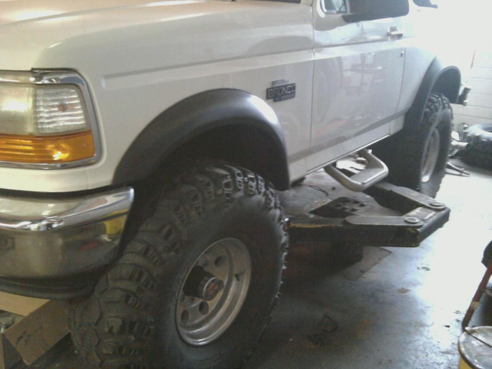 1996 Ford Bronco front fender, large off-road tire, and running board