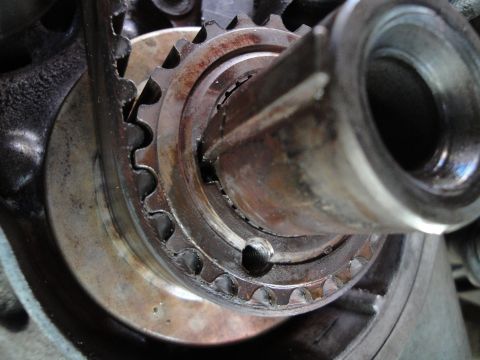 1995 Ford Taurus - Worn timing belt pulley and shaft, indicating potential engine component wear.